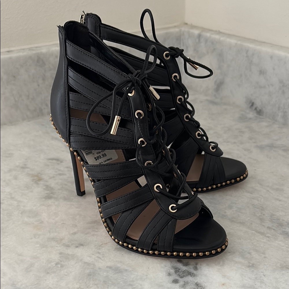 BCBGeneration Black Heels with Lace-Up Cage Design
